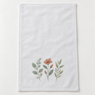 White hemmed fingertip towel with an example botanical custom print